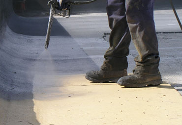 Coating systems over Jefferson City spray foam roof systems